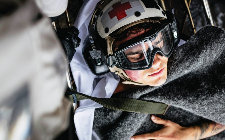 Sailors carry Intelligence Specialist 2nd Class Isaac Eaker, assigned to intelligence department’s satellite imagery analyzation division, to elevator on flight deck during medical drill aboard aircraft carrier USS George Washington while underway in Pacific Ocean, November 11, 2024 (U.S. Navy/August Clawson)